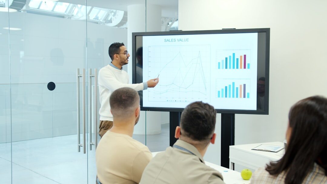 executives in boardroom discussing long-term business strategy