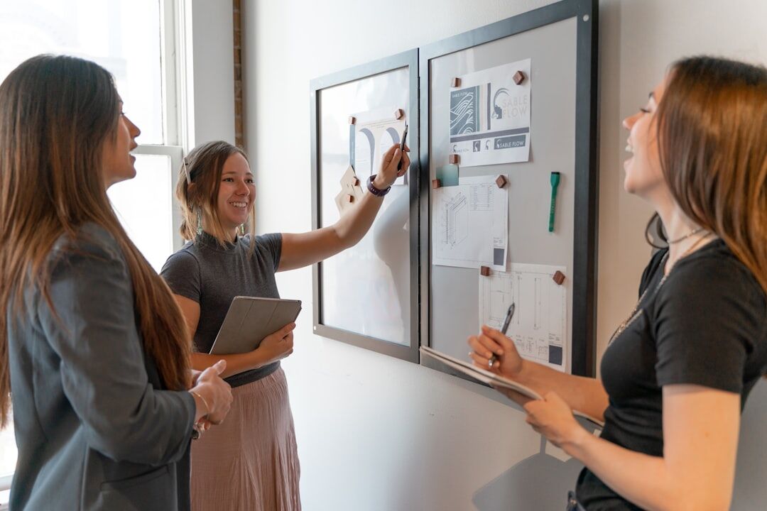diverse business team at whiteboard brainstorming strategy