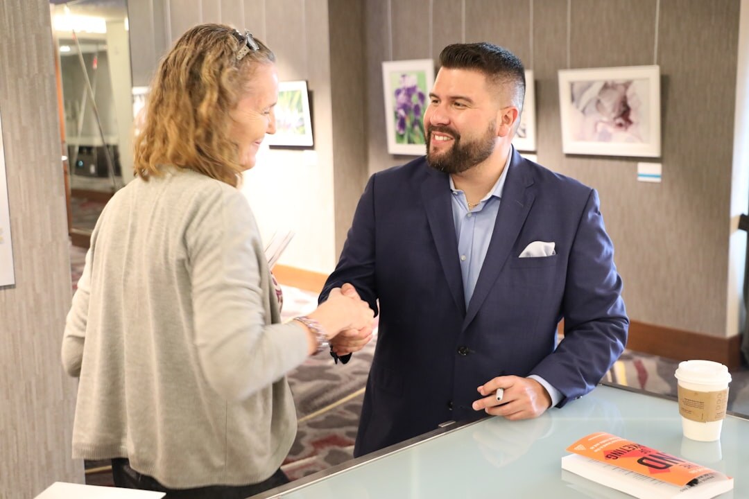 business consultant shaking hands with client
