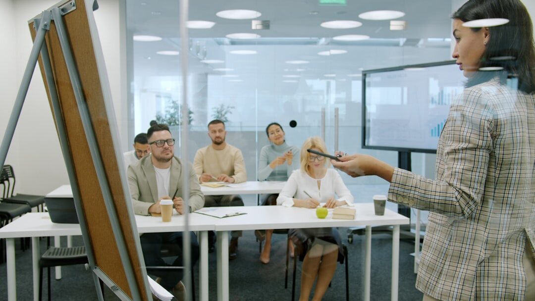 executives brainstorming ideas on whiteboard in boardroom